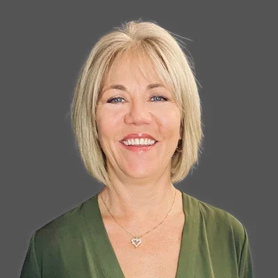 Jill Noble Smiling Warmly at Patients Team